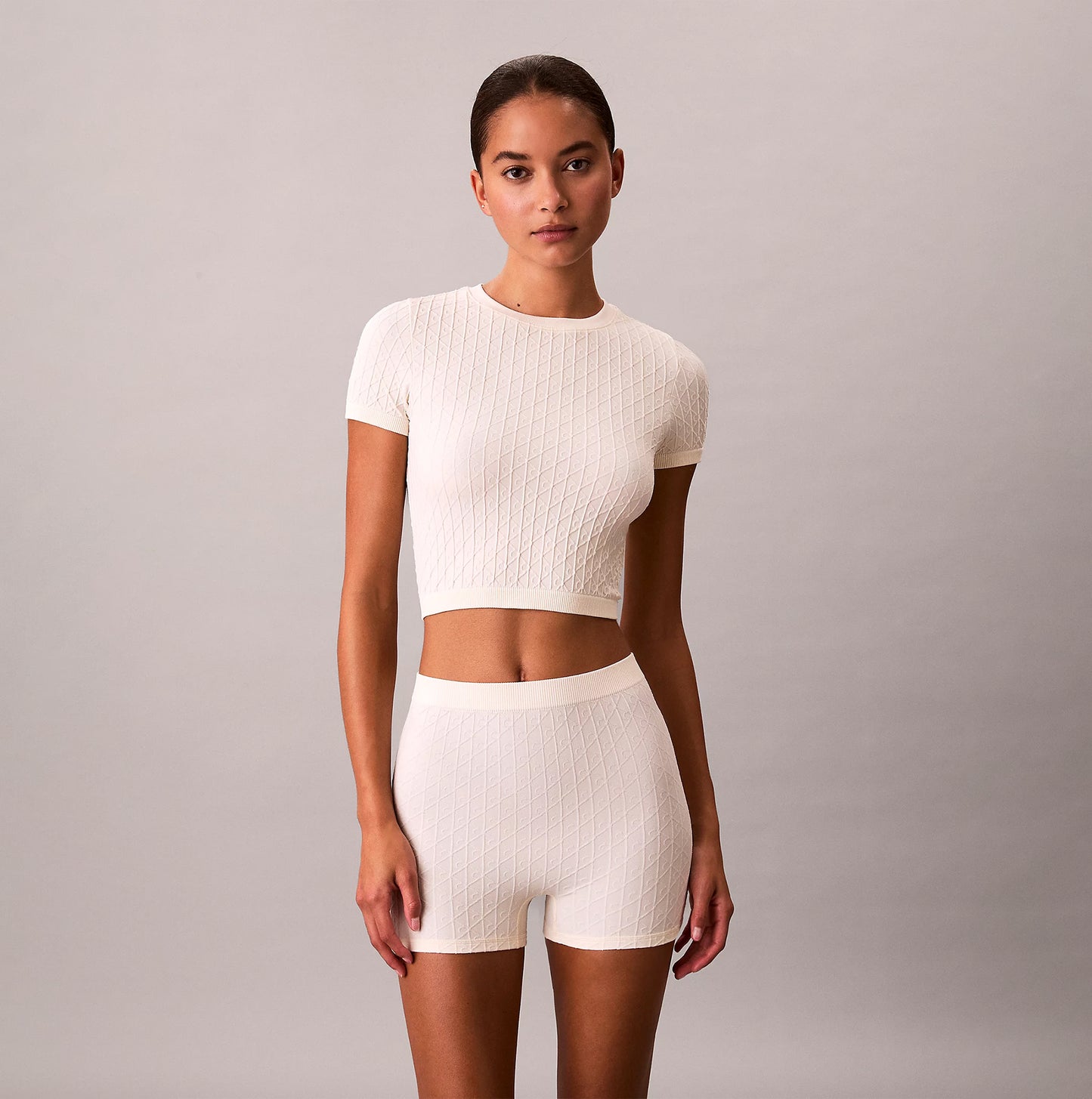 Calvin Klein SEAMLESS Womens Printed CK Knit T-Shirt Ivory